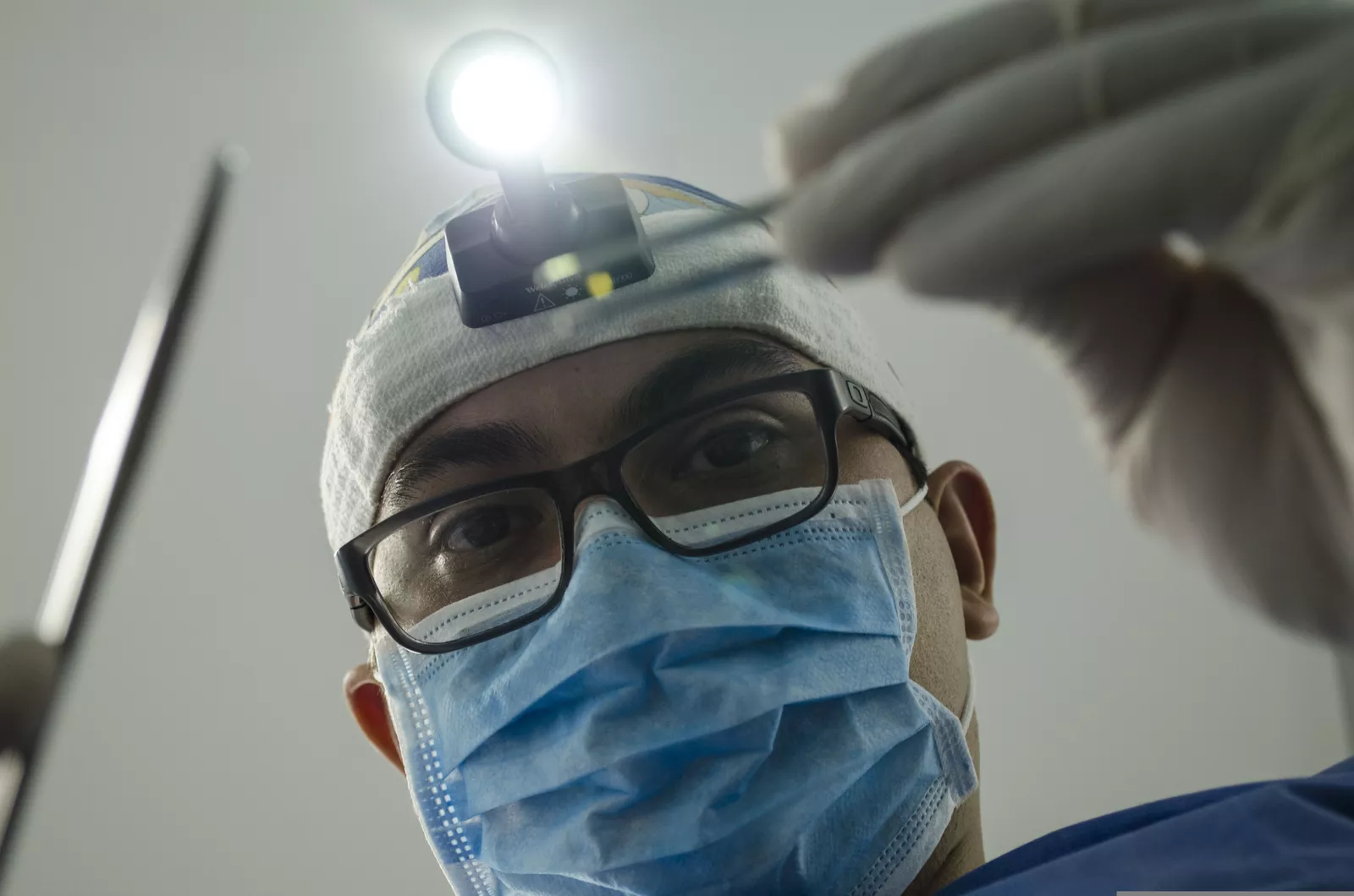 A dentist at work, guided by the latest in dental implant research.
