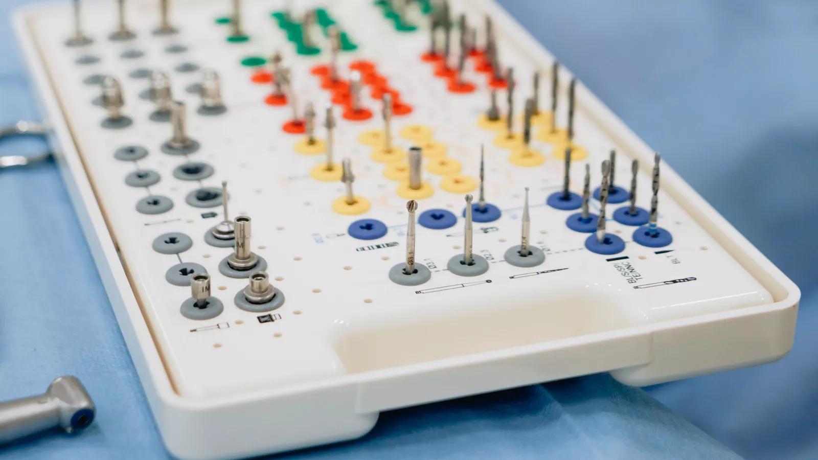 A close-up of a dental implant kit, with bur selection included.